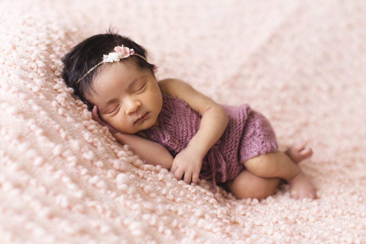 Toddler Lying on Pink Fleece Pad